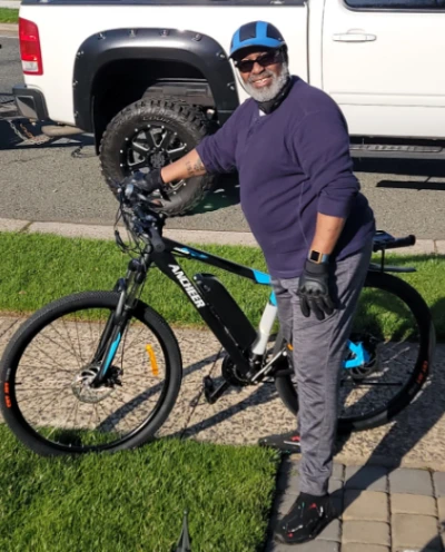 ANCHEER Electric Bike older man ridinf and enjoying